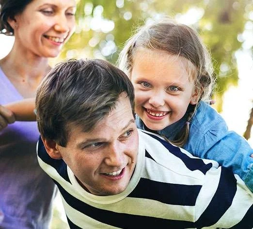 family smiling veneers image
