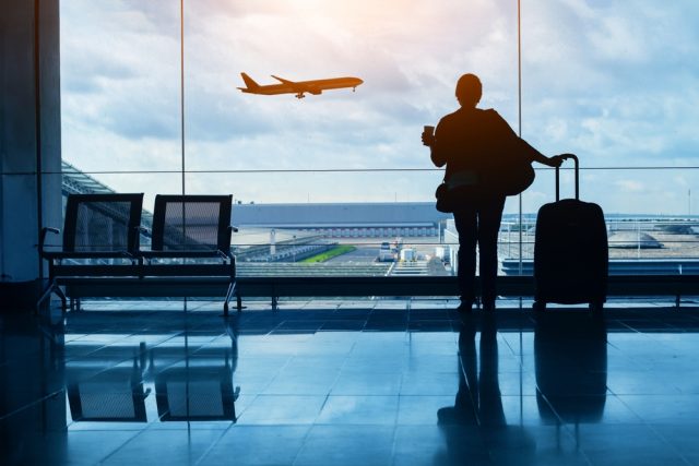 woman preparing to travel by plane
