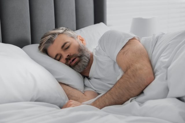 man snoring and sleeping