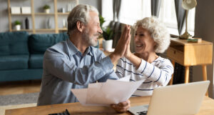 older couple high fiving