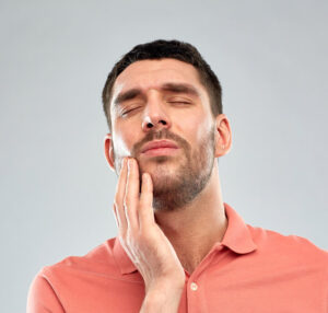 man with mouth pain